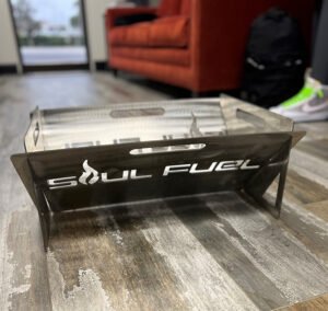 Stainless steel fire pit with Soul Fuel logo